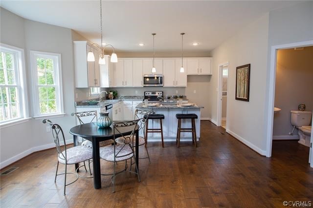 Lot 10 Corte Castle Road Chesterfield, VA 23838 - Photo 7 of 37 a view of a dining room with furniture and wooden floor