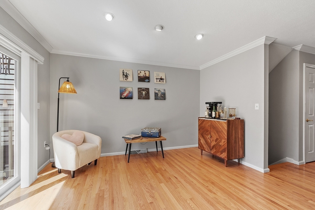13 Boulderbrook Drive, Unit 13 Peabody, MA 01960 - Photo 12 of 41 a living room with furniture and a wooden floor