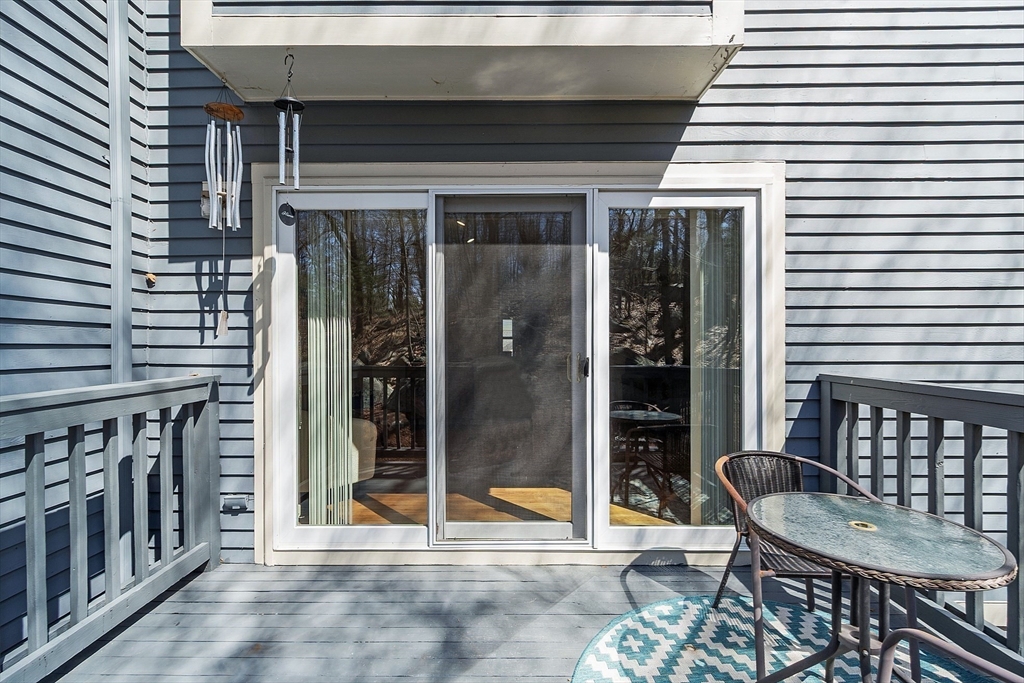13 Boulderbrook Drive, Unit 13 Peabody, MA 01960 - Photo 15 of 41 a porch with seating space and glass door