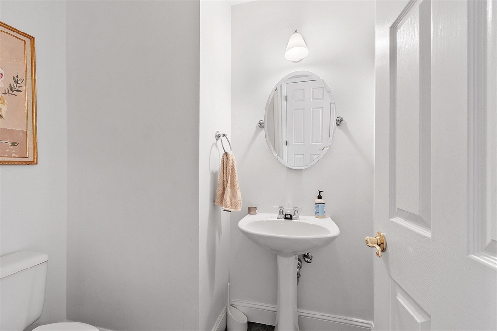 13 Boulderbrook Drive, Unit 13 Peabody, MA 01960 - Photo 17 of 41 a bathroom with a sink toilet and a mirror
