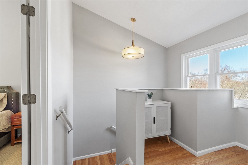 13 Boulderbrook Drive, Unit 13 Peabody, MA 01960 - Photo 21 of 41 a view of a hallway with wooden floor and cabinet