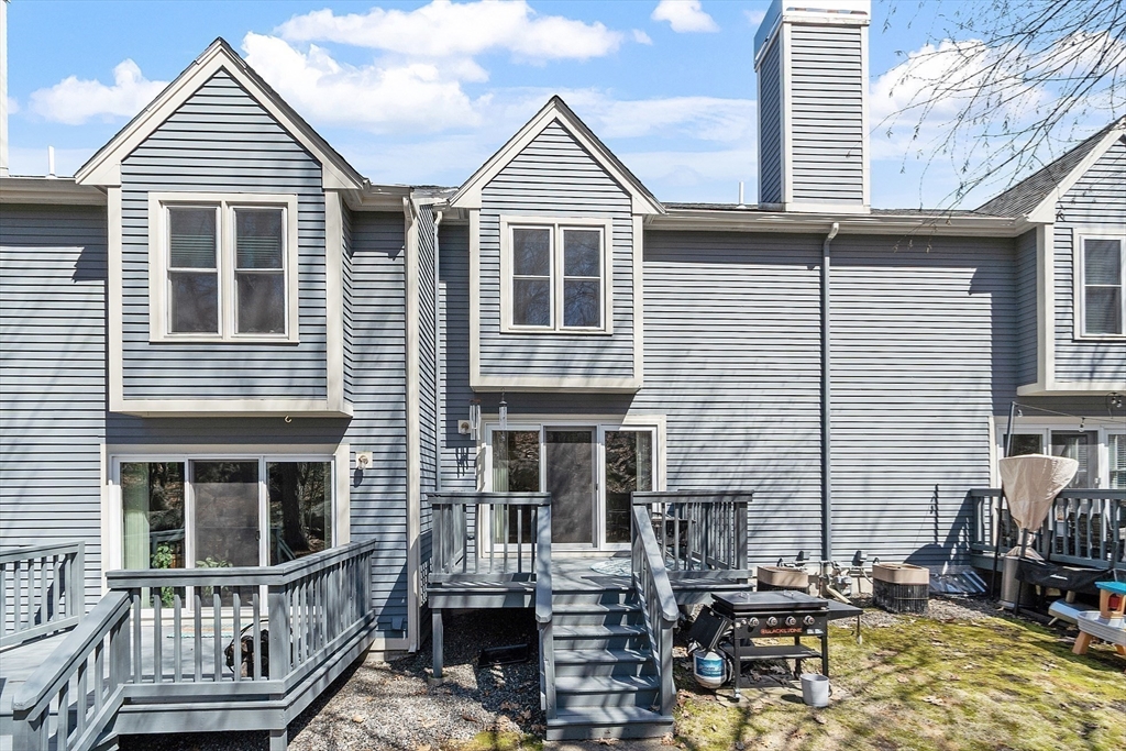 13 Boulderbrook Drive, Unit 13 Peabody, MA 01960 - Photo 32 of 41 a view of house with ocean view and a wooden floor