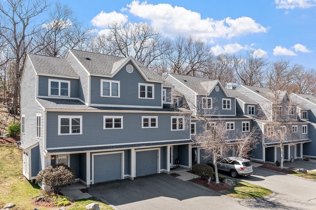 13 Boulderbrook Drive, Unit 13 Peabody, MA 01960 - Photo 35 of 41 a front view of a building with lot of cars parked
