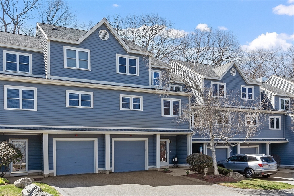 13 Boulderbrook Drive, Unit 13 Peabody, MA 01960 - Photo 39 of 41 a front view of a house with yard outdoor seating and garage