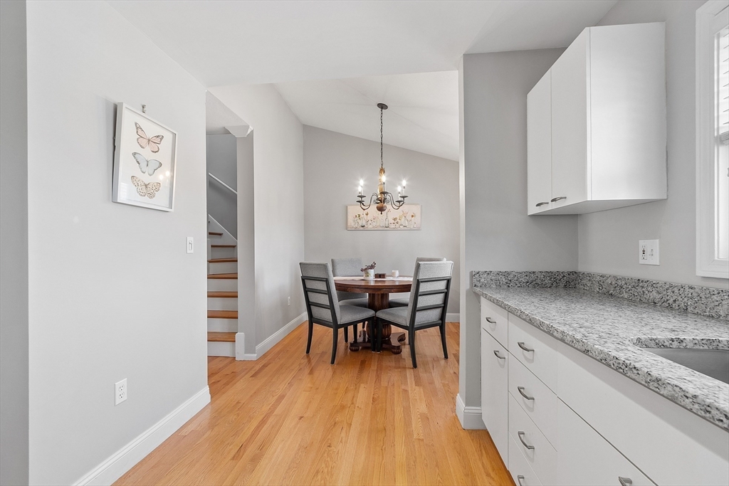 13 Boulderbrook Drive, Unit 13 Peabody, MA 01960 - Photo 8 of 41 a view of a kitchen area with furniture and wooden floor
