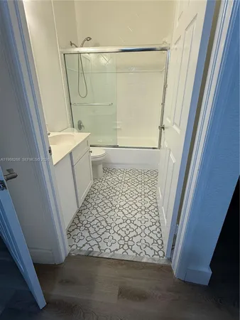 a bathroom with a sink and a shower