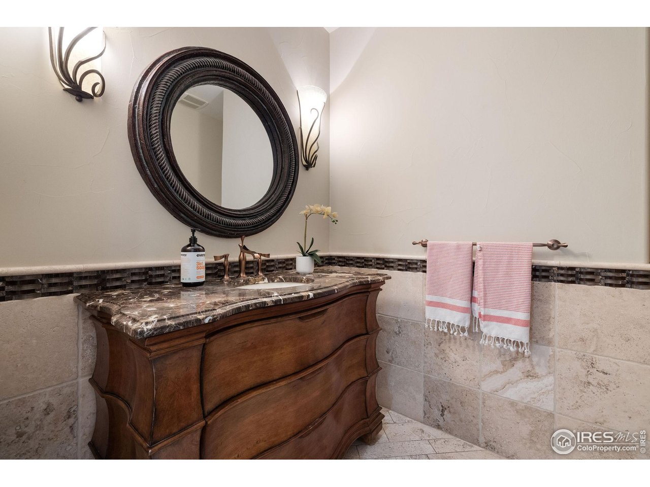 7205 Rustic Trail Boulder, CO 80301 - Photo 23 of 49 a bathroom with a granite countertop sink a mirror and a shower