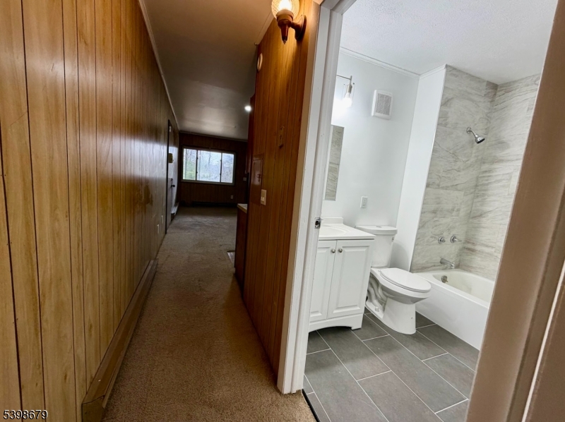254 Clove Road, Unit G Montague, NJ 07827 - Photo 12 of 14 a bathroom with a toilet and a shower
