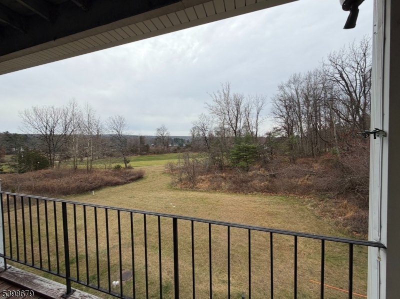 254 Clove Road, Unit G Montague, NJ 07827 - Photo 13 of 14 a view of a balcony with wooden floor and lake view