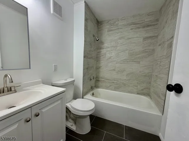 a bathroom with a toilet sink and bathtub