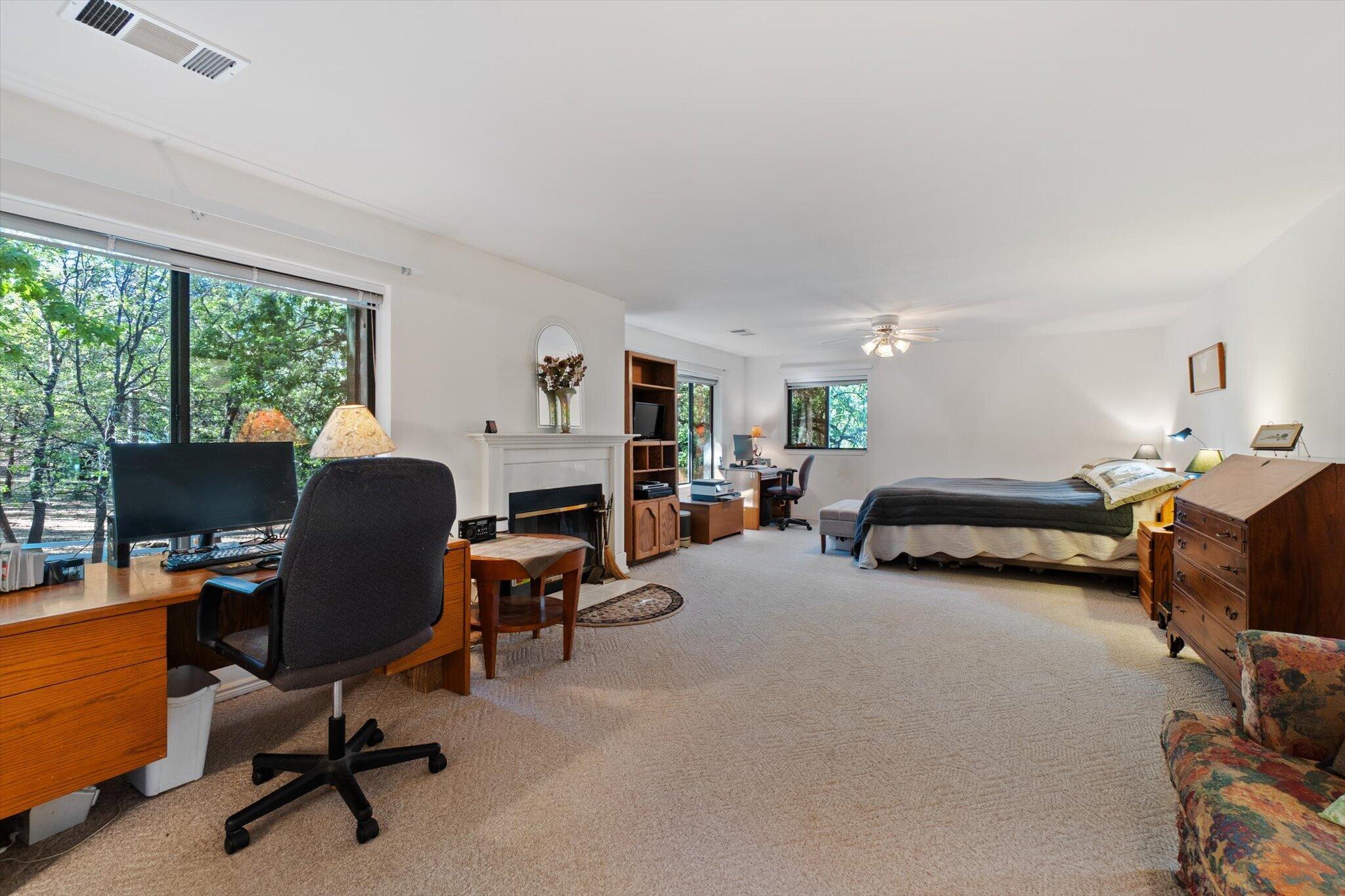 26997 Lookout Mountain Road Oak Run, CA 96069 - Photo 30 of 92 a view of a livingroom with workspace and a window