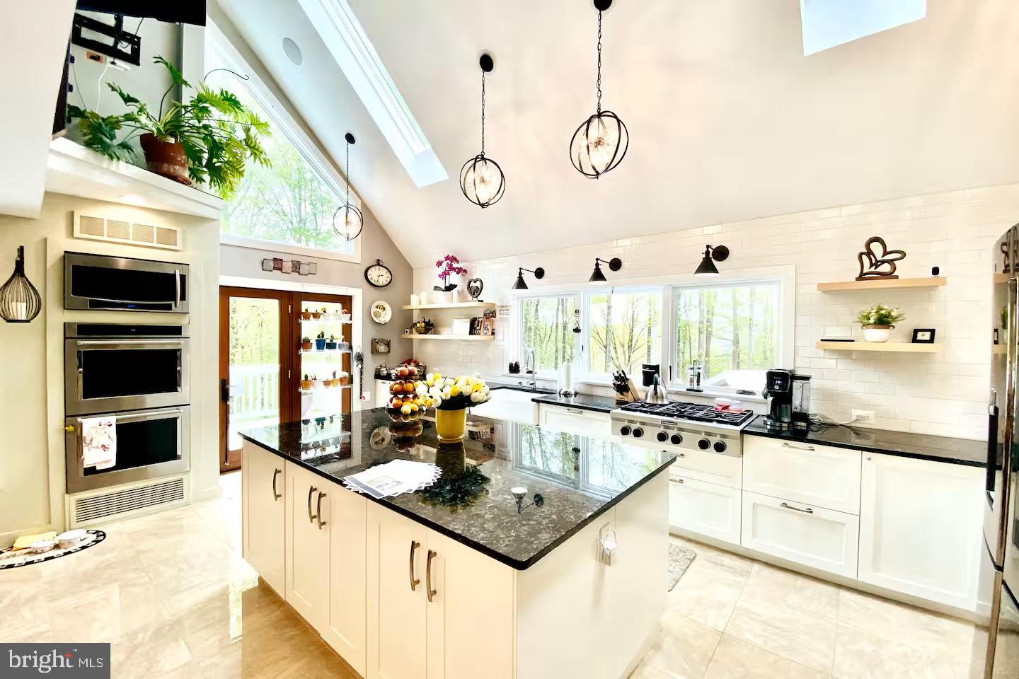 19319 Harmony Church Road Leesburg, VA 20175 - Photo 13 of 65 a kitchen with stainless steel appliances granite countertop a sink and cabinets