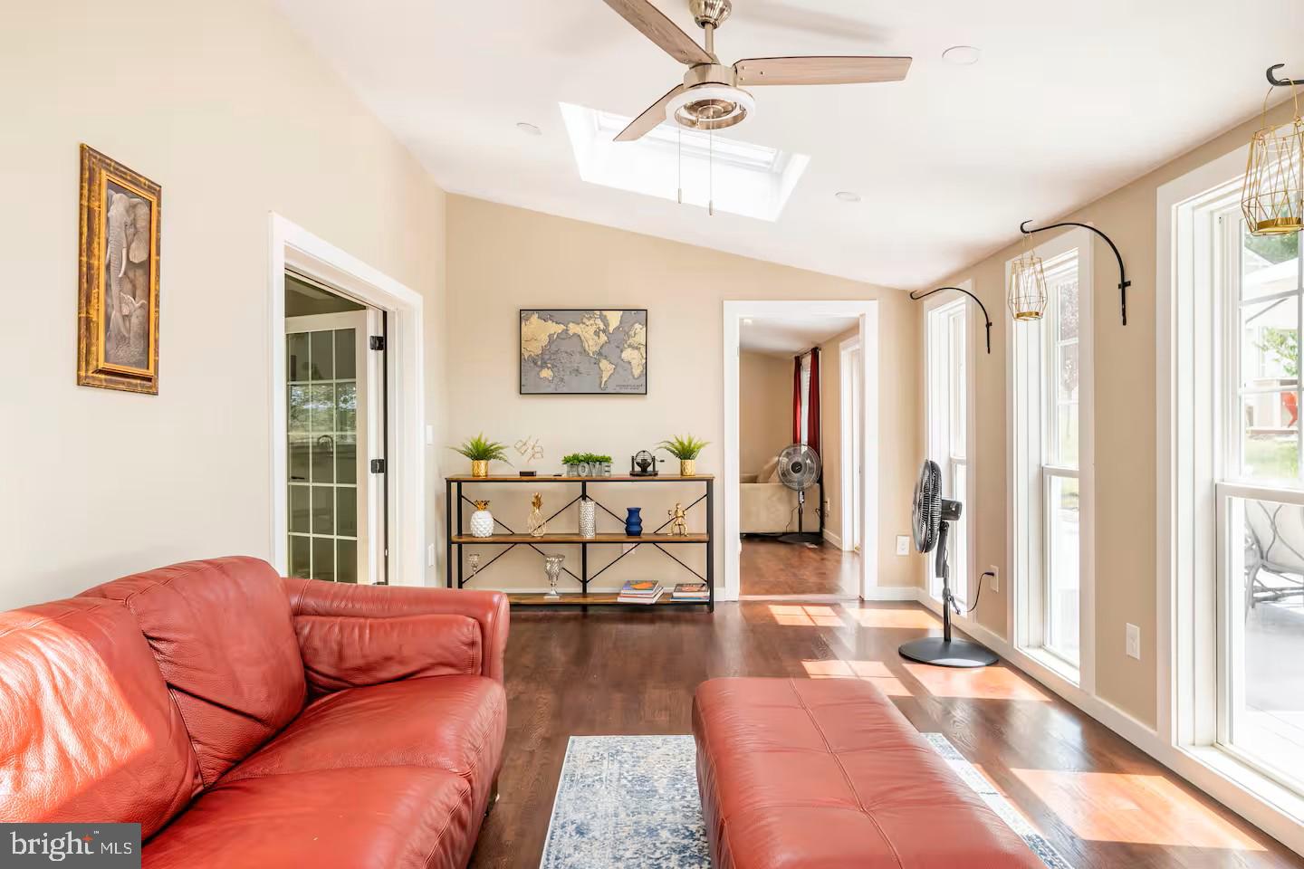 19319 Harmony Church Road Leesburg, VA 20175 - Photo 21 of 65 a living room with furniture and a floor to ceiling window