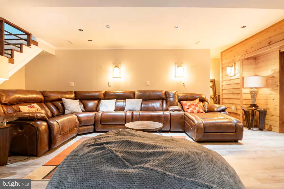 19319 Harmony Church Road Leesburg, VA 20175 - Photo 28 of 65 a hotel room with large couches and large windows