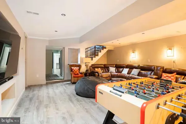 a bedroom with a bed and a night stand