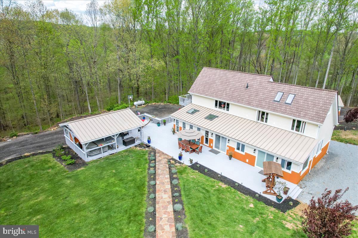 19319 Harmony Church Road Leesburg, VA 20175 - Photo 3 of 65 an aerial view of a house with a big yard and large trees
