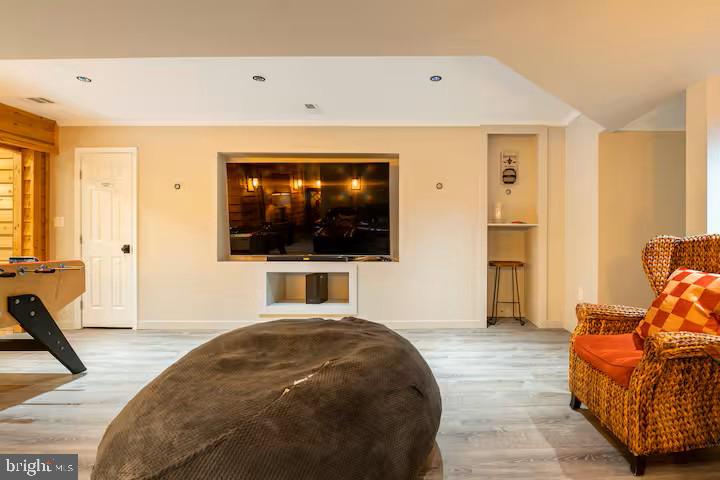 19319 Harmony Church Road Leesburg, VA 20175 - Photo 32 of 65 a living room with furniture and a flat screen tv