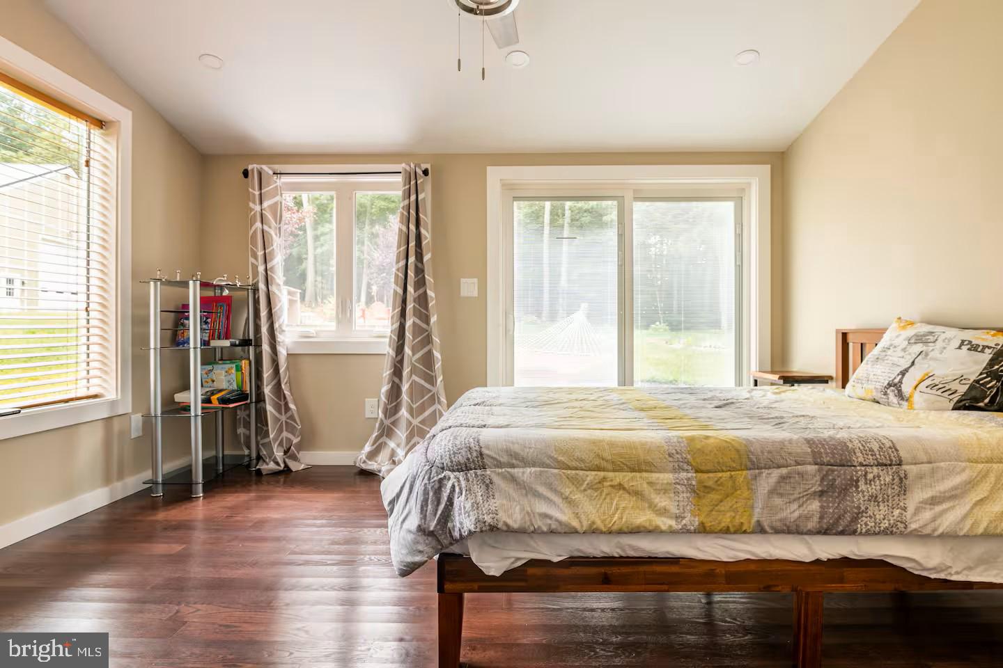 19319 Harmony Church Road Leesburg, VA 20175 - Photo 37 of 65 a bedroom with a bed and wooden floor