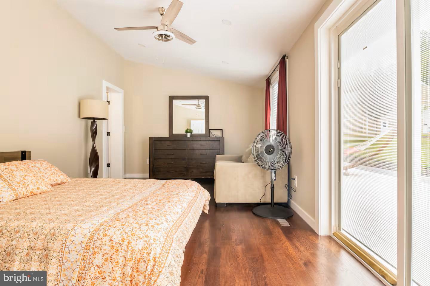 19319 Harmony Church Road Leesburg, VA 20175 - Photo 39 of 65 a bedroom with a bed and a large window