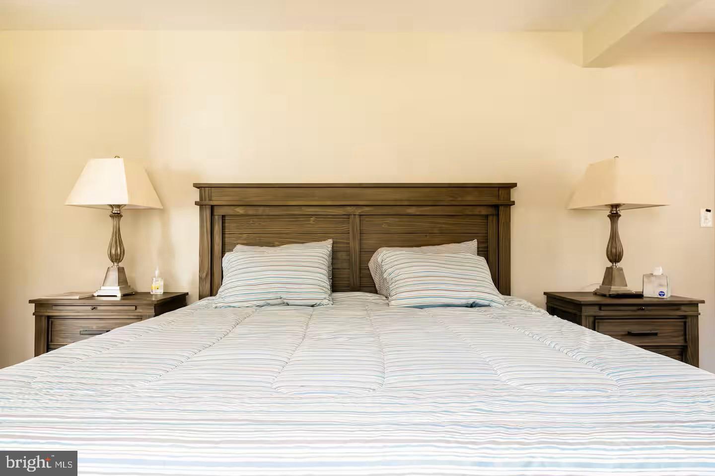 19319 Harmony Church Road Leesburg, VA 20175 - Photo 40 of 65 a bedroom with a bed and a lamp