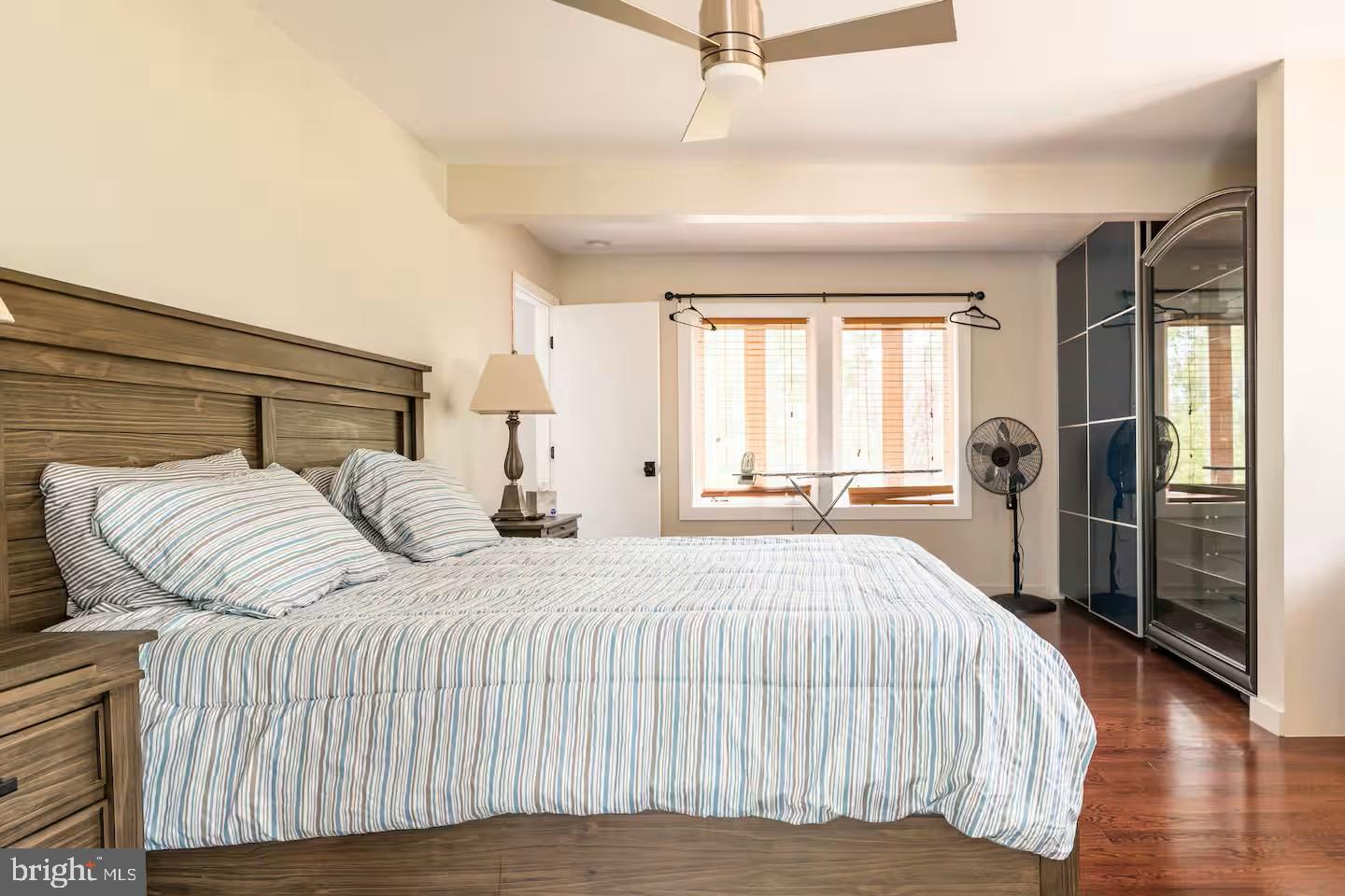 19319 Harmony Church Road Leesburg, VA 20175 - Photo 41 of 65 a bedroom with a bed and wooden floor