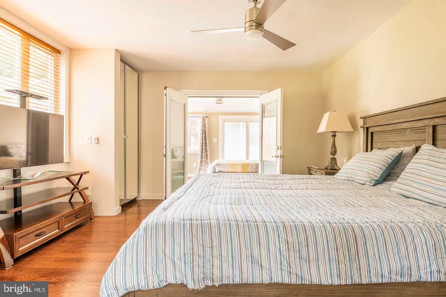 19319 Harmony Church Road Leesburg, VA 20175 - Photo 42 of 65 a bedroom with a bed and a chandelier