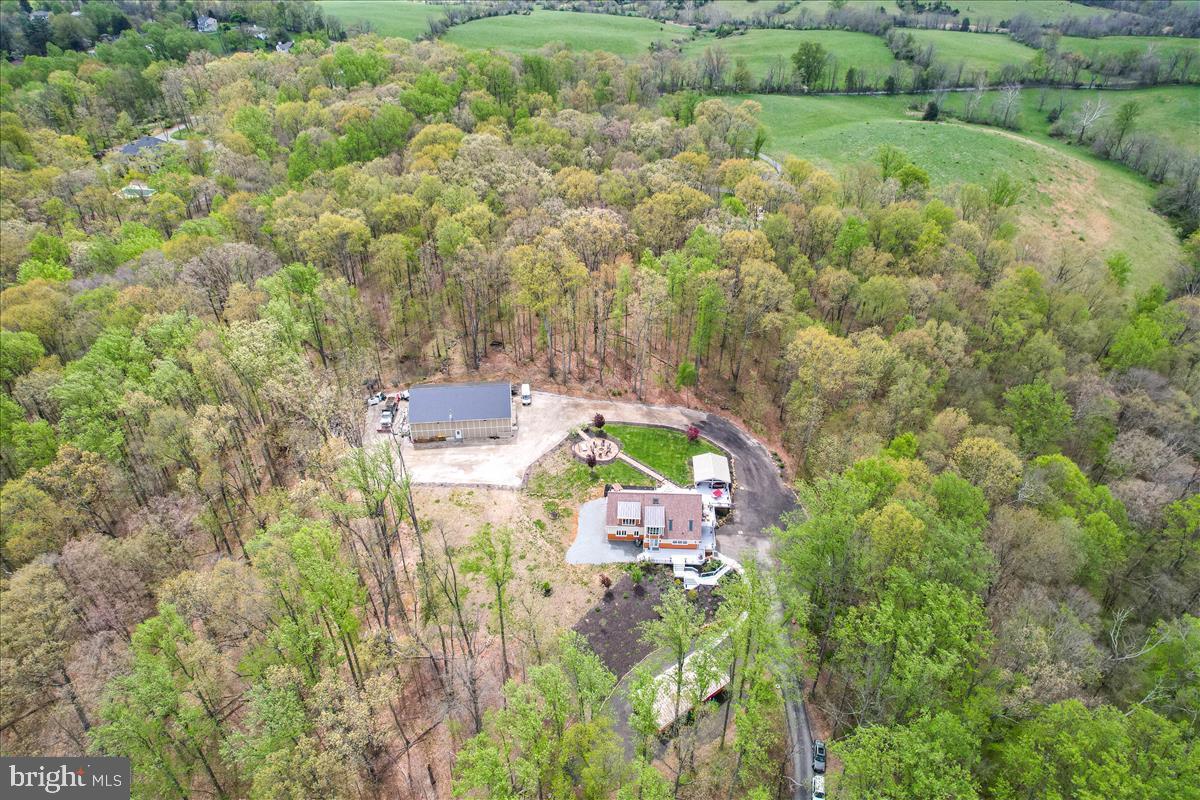 19319 Harmony Church Road Leesburg, VA 20175 - Photo 5 of 65 an aerial view of residential house with outdoor space and trees all around