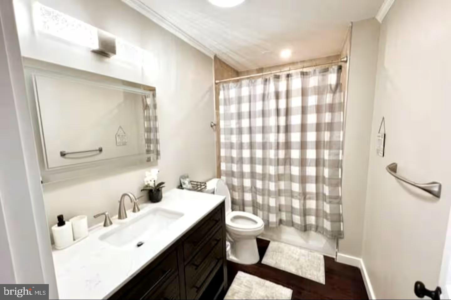 19319 Harmony Church Road Leesburg, VA 20175 - Photo 52 of 65 a bathroom with a double vanity sink toilet and shower