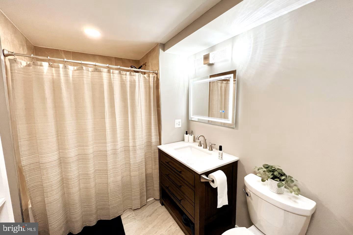 19319 Harmony Church Road Leesburg, VA 20175 - Photo 55 of 65 a bathroom with a sink toilet and shower