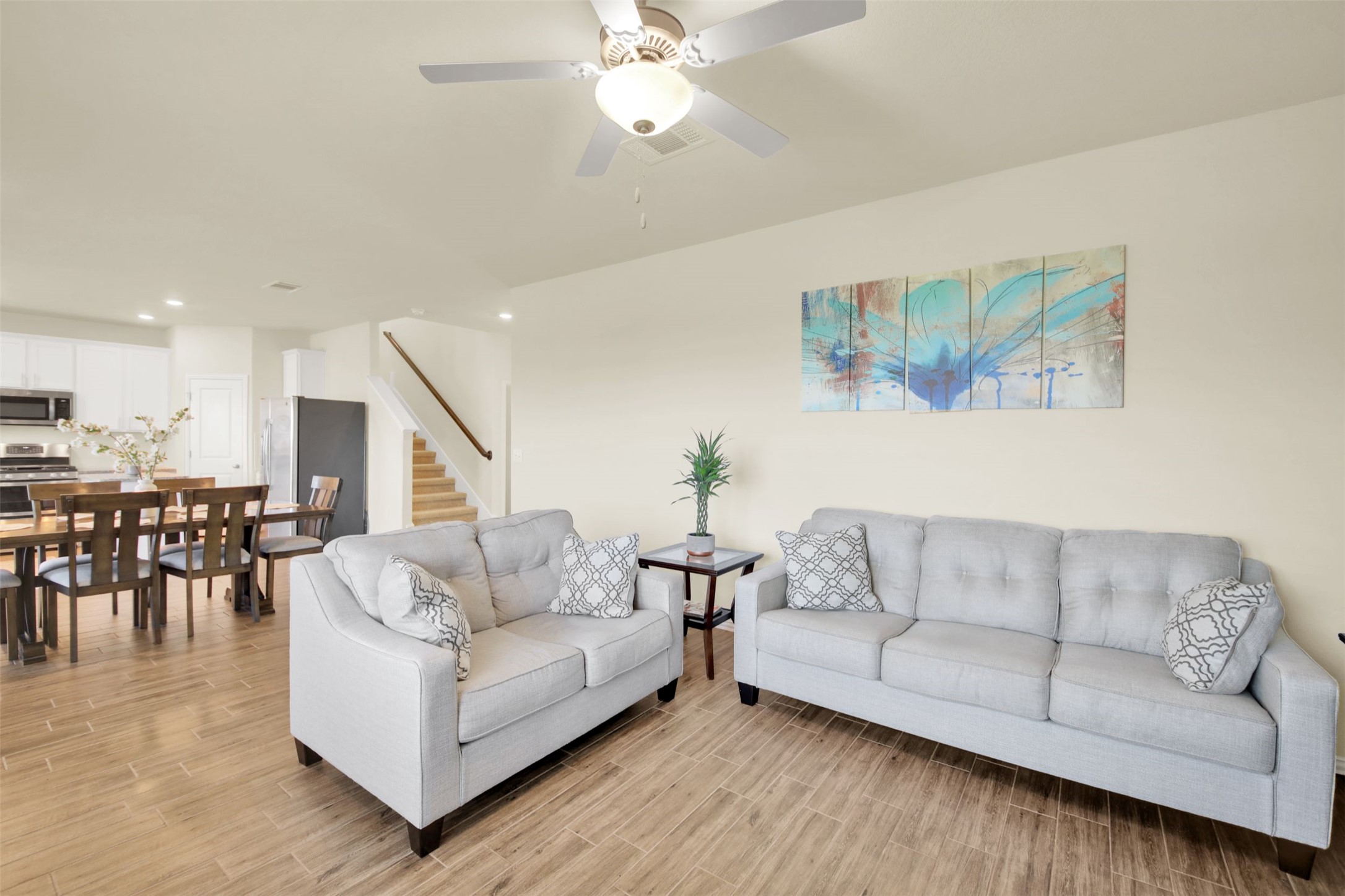 13716 Sugar Bush Path Manor, TX 78653 - Photo 17 of 37 Living room with ceiling fan, wood finish floors, and recessed lighting