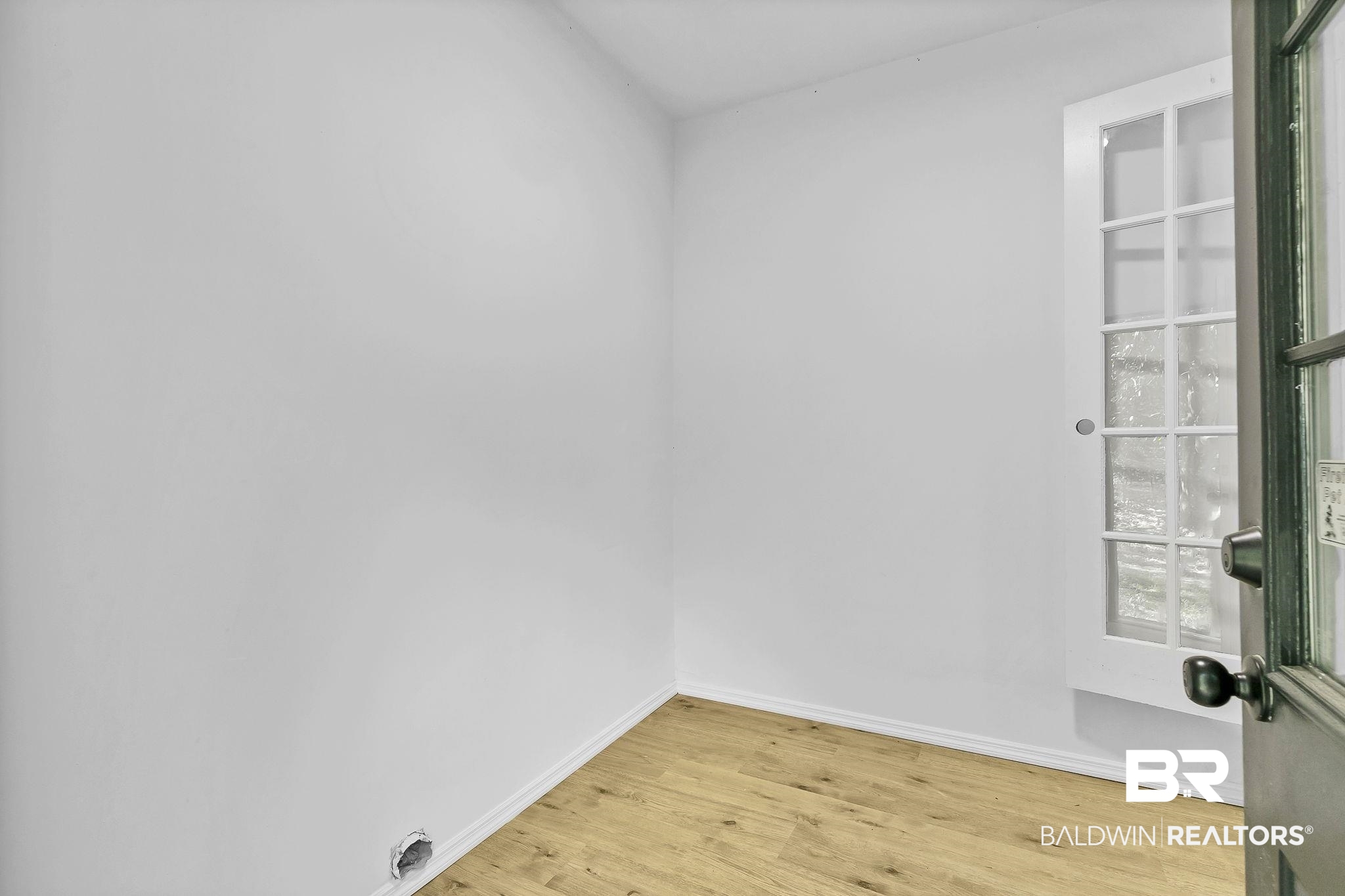203 Anderson Road Saraland, AL 36571 - Photo 21 of 48 Unfurnished room with light wood-type flooring and baseboards