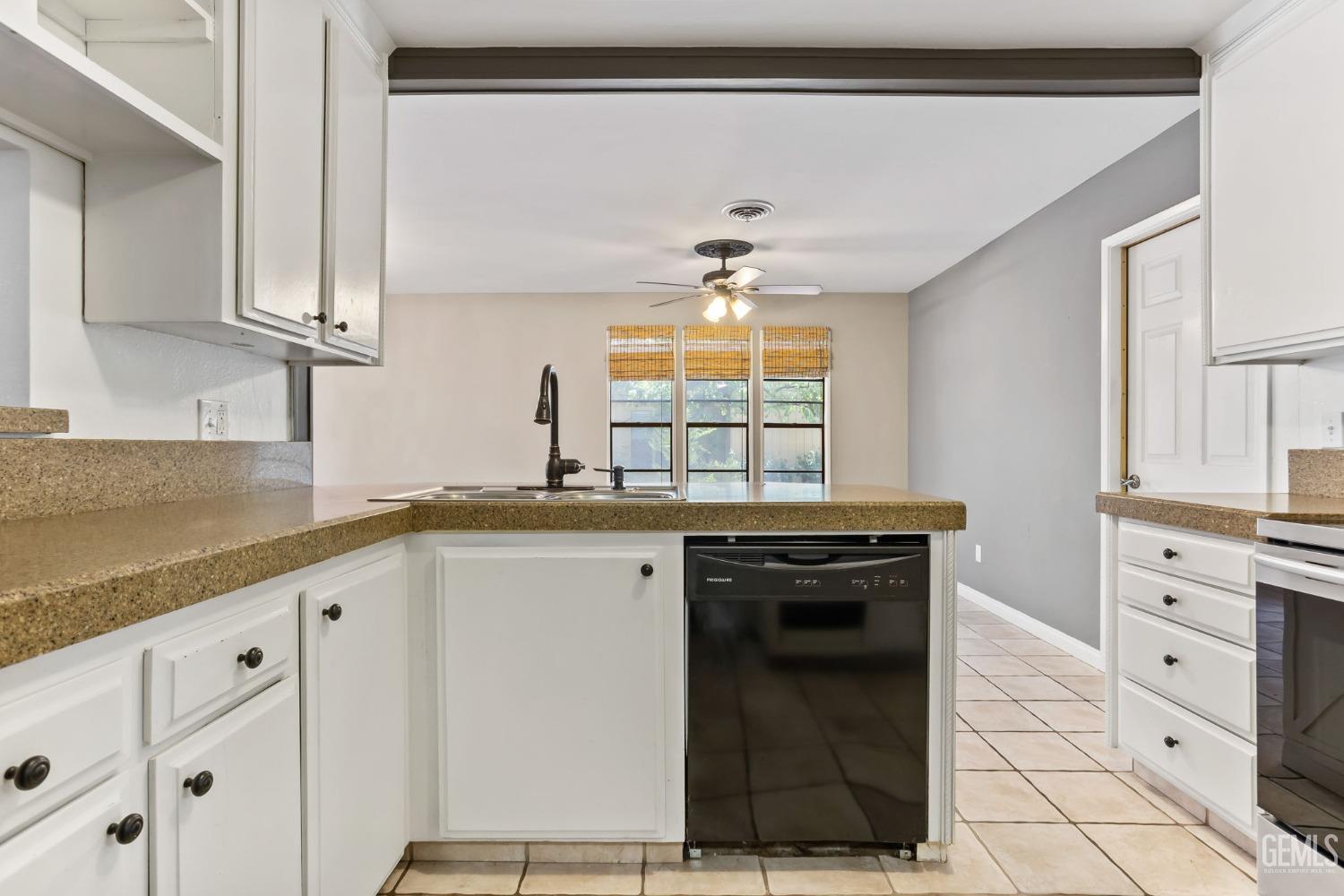 Undisclosed Address Bakersfield, CA 93306 - Photo 15 of 61 a kitchen with granite countertop a sink and cabinets