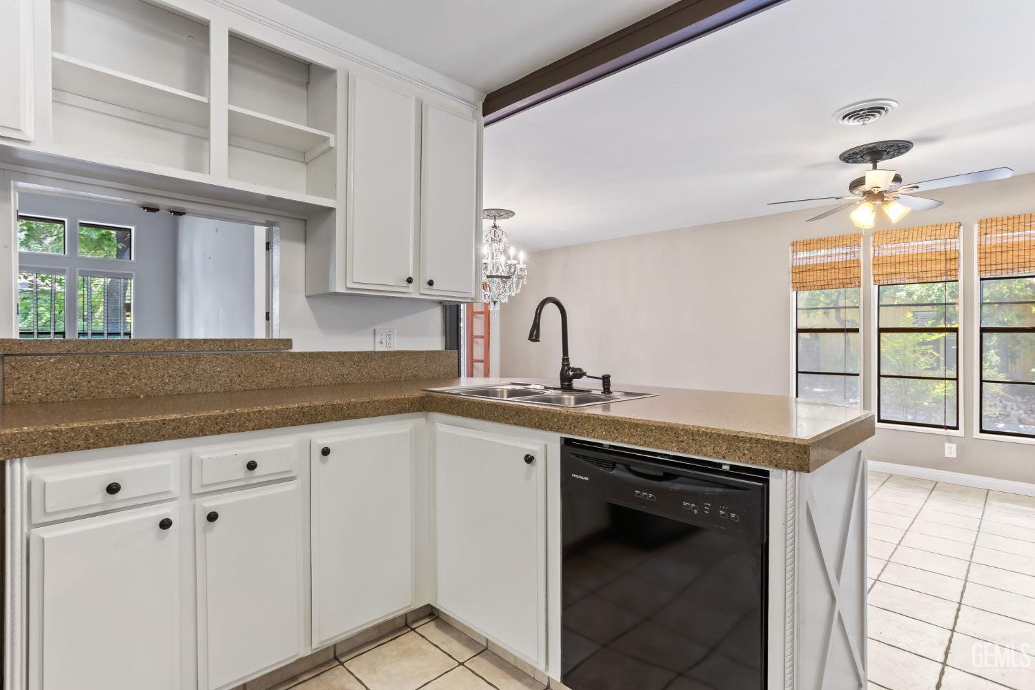 Undisclosed Address Bakersfield, CA 93306 - Photo 18 of 61 a kitchen with a sink and cabinets