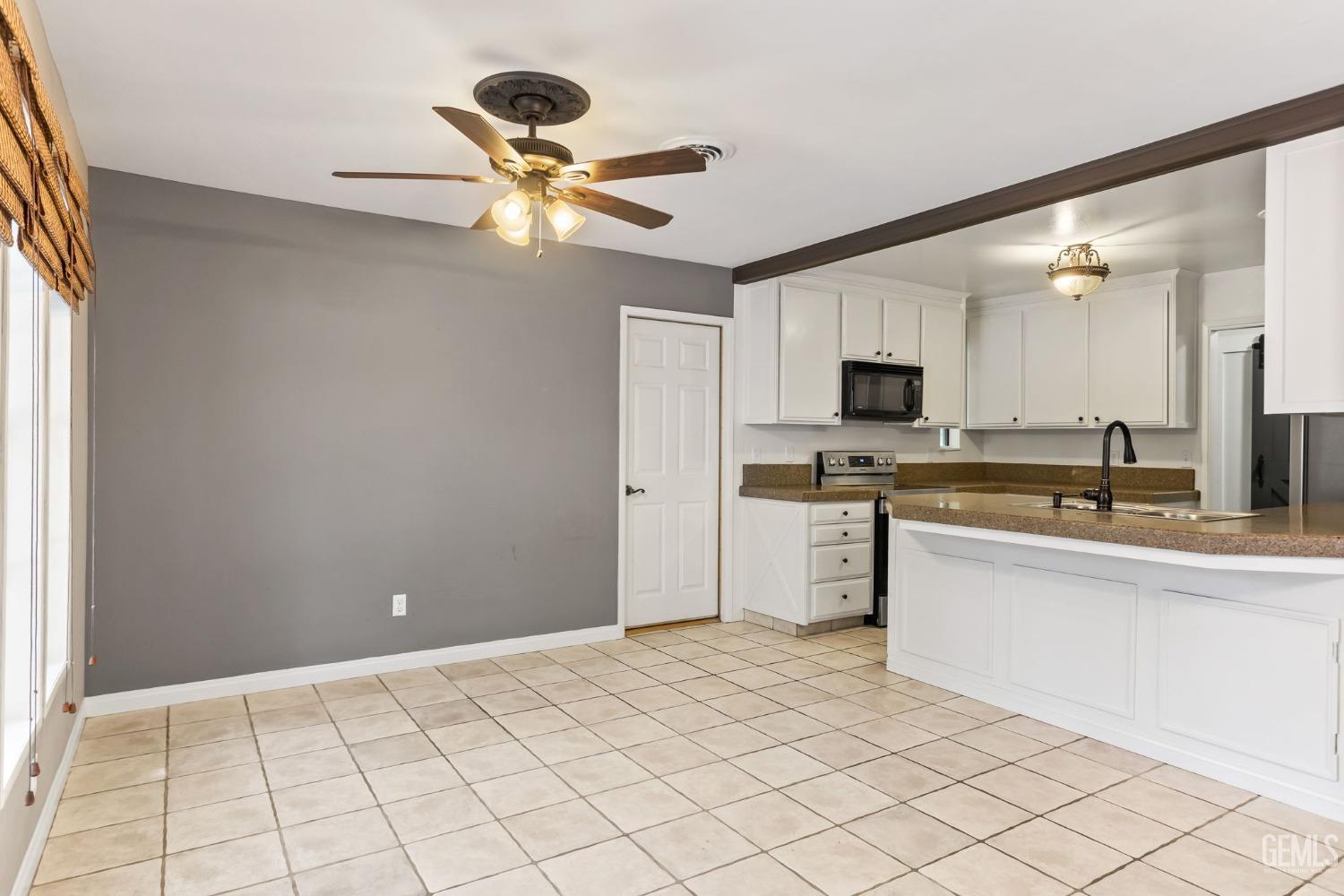 Undisclosed Address Bakersfield, CA 93306 - Photo 22 of 61 a view of a kitchen with a sink