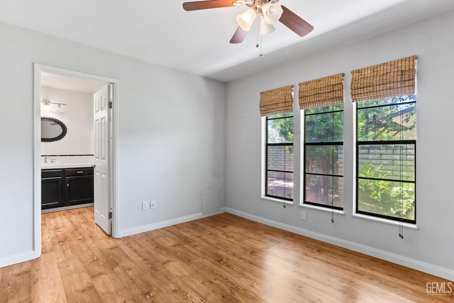 Undisclosed Address Bakersfield, CA 93306 - Photo 28 of 61 a view of an empty room with a window and a kitchen