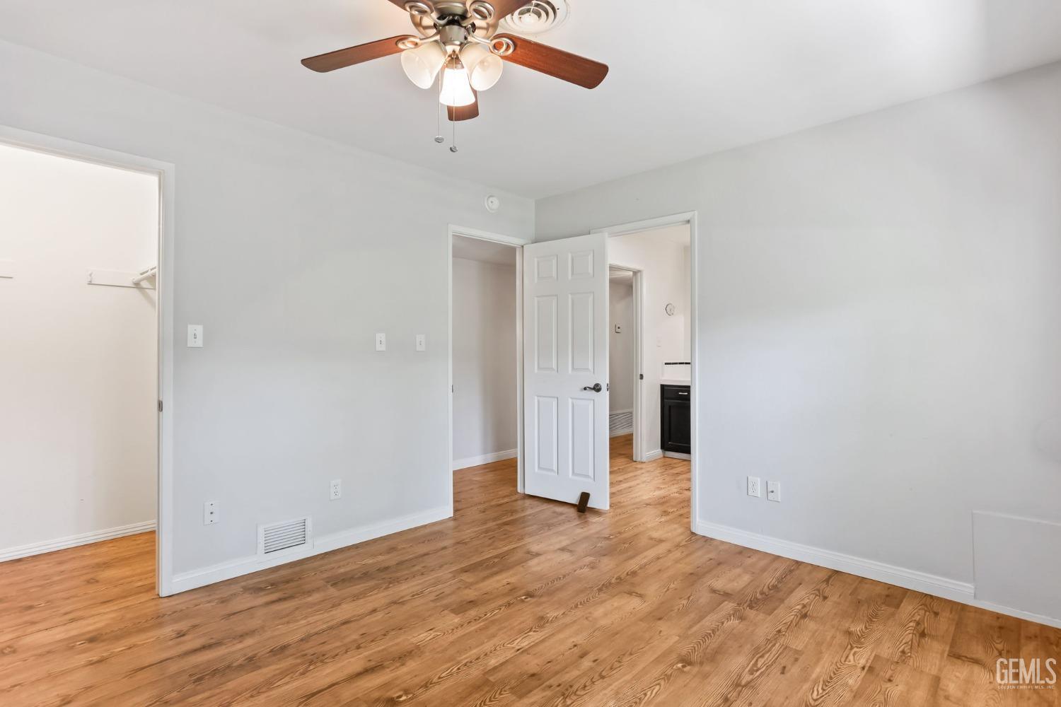 Undisclosed Address Bakersfield, CA 93306 - Photo 32 of 61 a view of an empty room with wooden floor