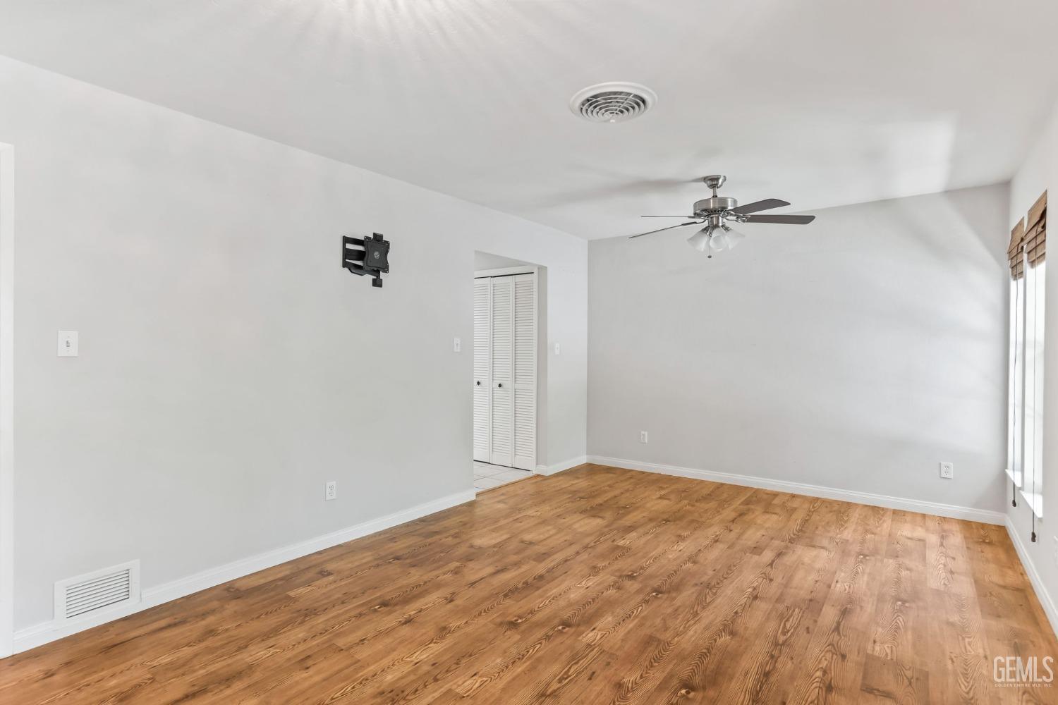 Undisclosed Address Bakersfield, CA 93306 - Photo 35 of 61 a view of empty room with wooden floor