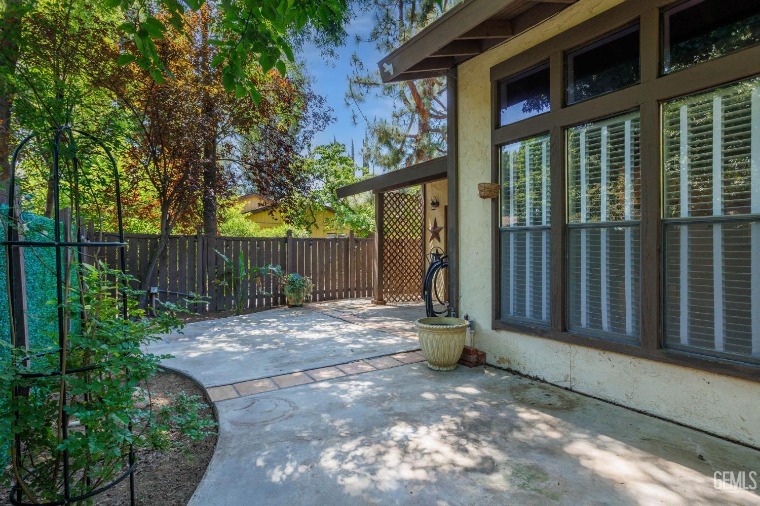 Undisclosed Address Bakersfield, CA 93306 - Photo 40 of 61 a backyard of a house with lots of green space