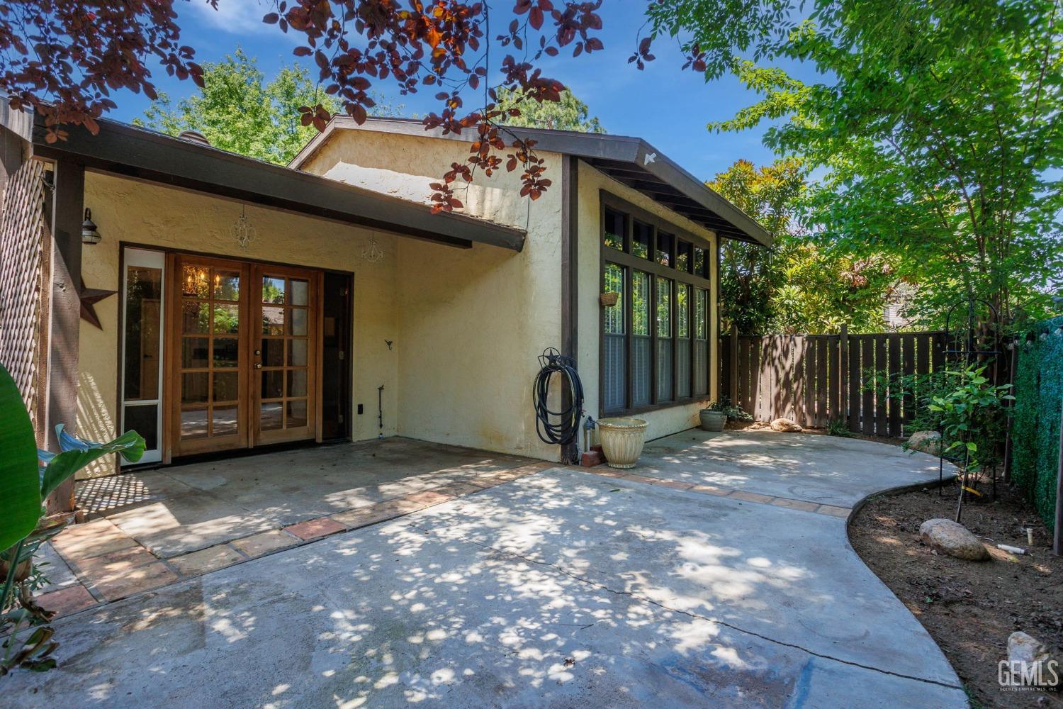 Undisclosed Address Bakersfield, CA 93306 - Photo 4 of 61 a view of a house with backyard and garden