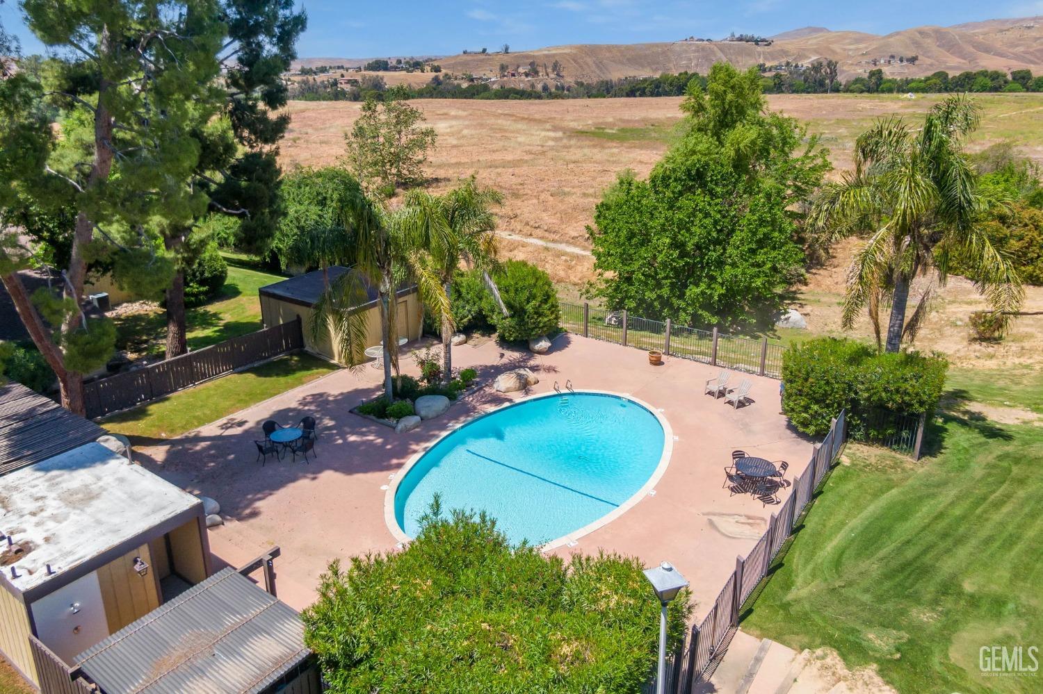 Undisclosed Address Bakersfield, CA 93306 - Photo 51 of 61 an aerial view of a house with outdoor space and lake view