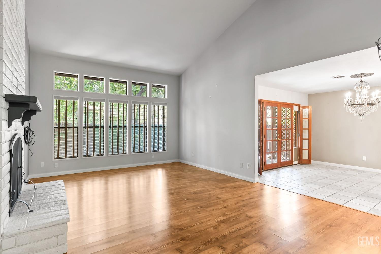 Undisclosed Address Bakersfield, CA 93306 - Photo 10 of 61 a view of an empty room with wooden floor and a window