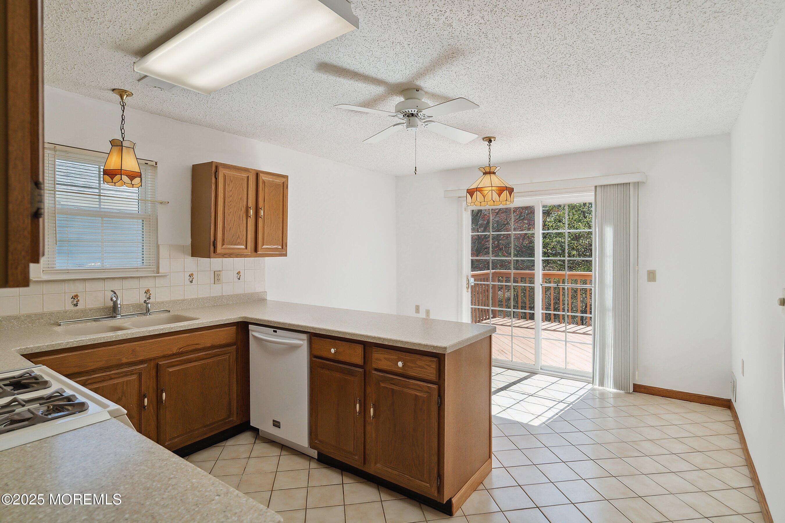 32 Pine Oak Boulevard Barnegat, NJ 08005 - Photo 12 of 40 a view of a kitchen with a sink and cabinets