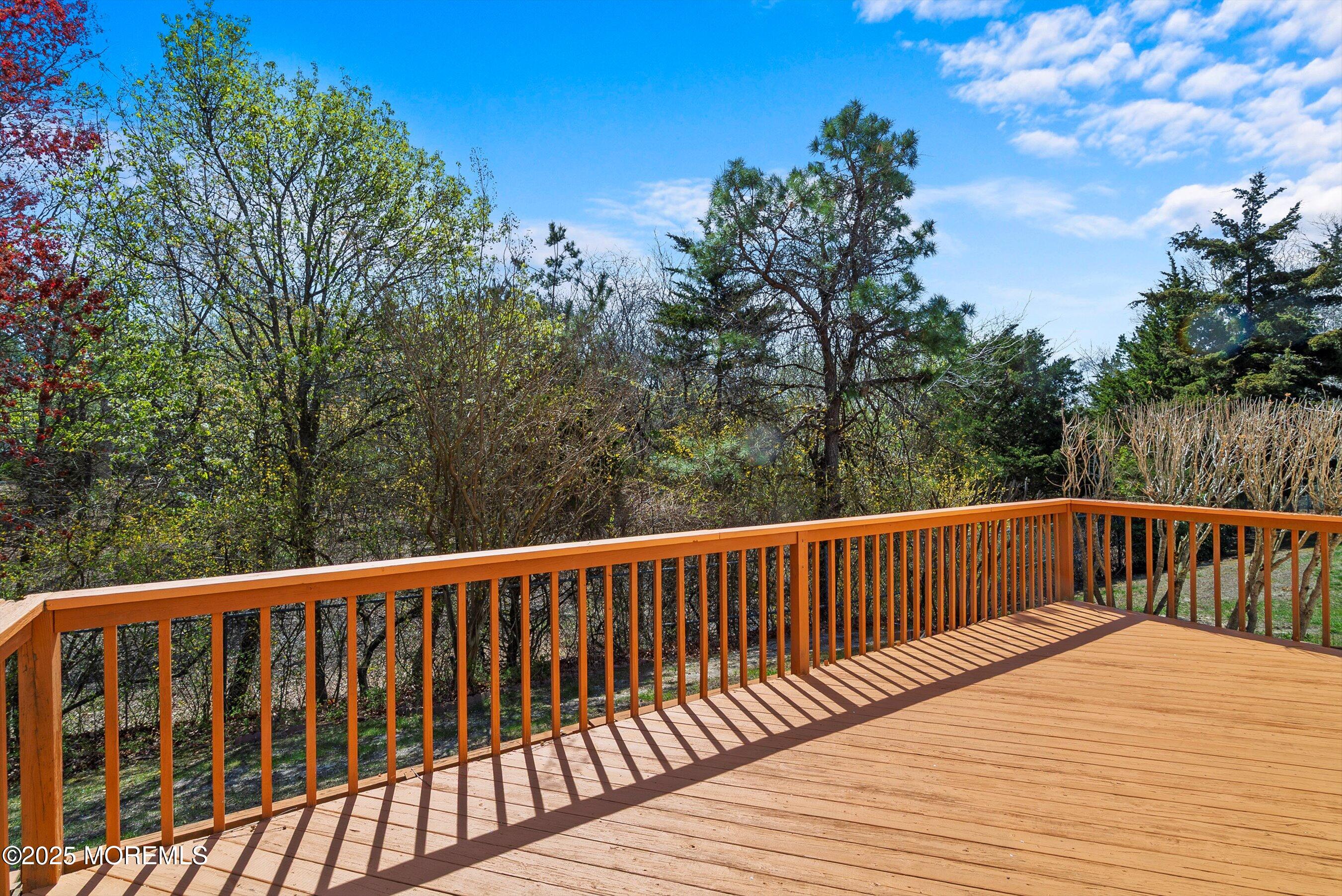 32 Pine Oak Boulevard Barnegat, NJ 08005 - Photo 13 of 40 a balcony with wooden floor and fence