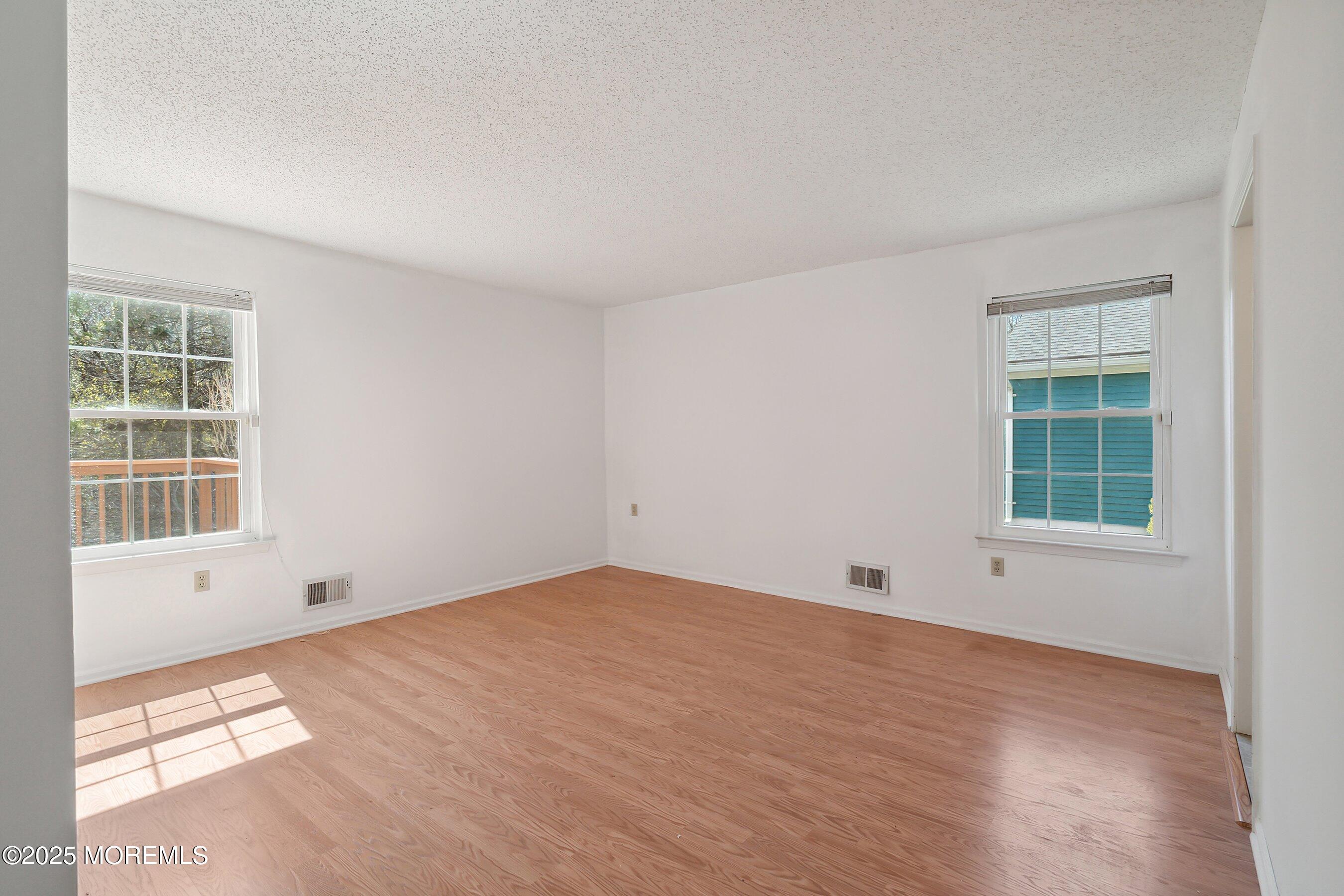 32 Pine Oak Boulevard Barnegat, NJ 08005 - Photo 21 of 40 a view of empty room with windows
