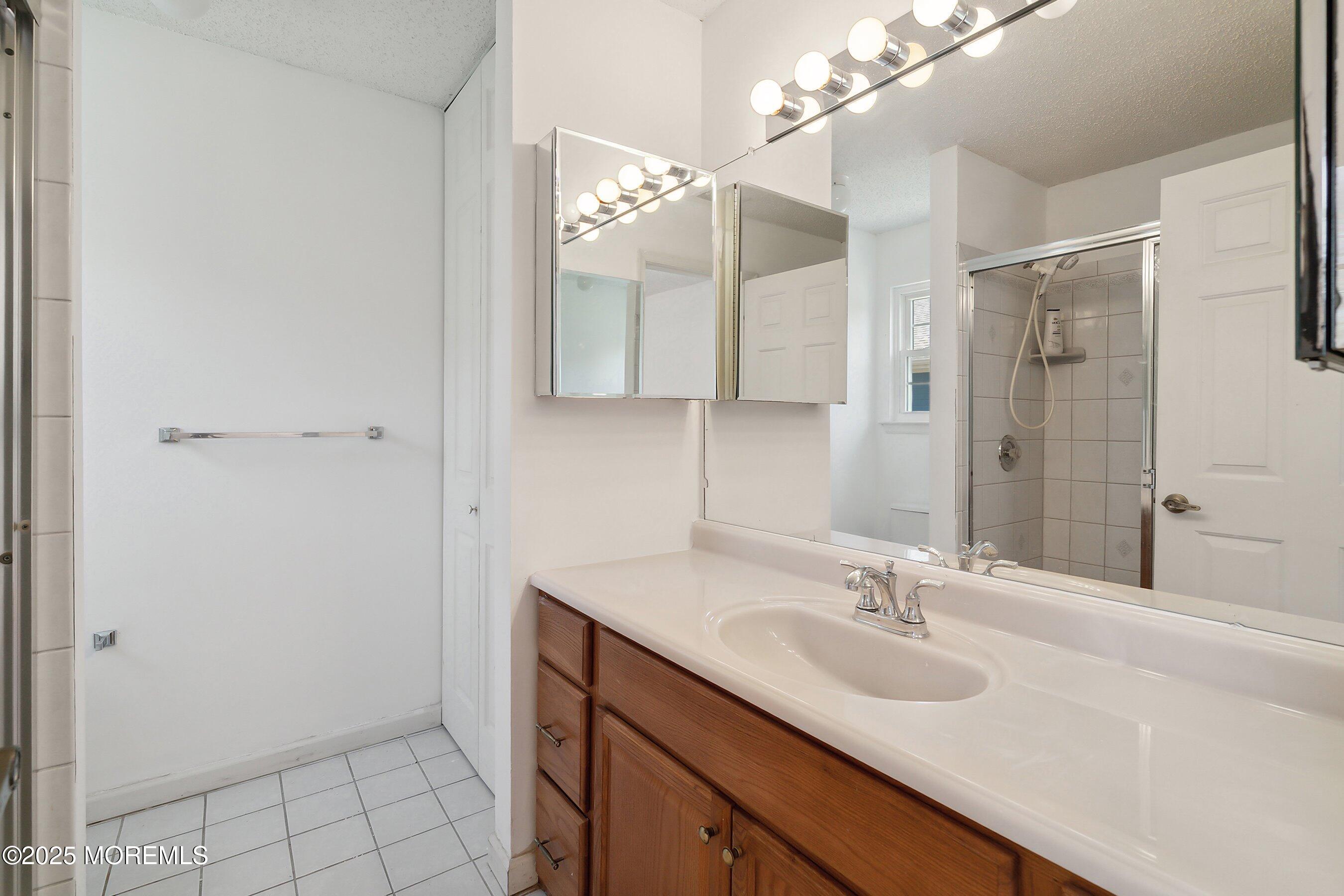 32 Pine Oak Boulevard Barnegat, NJ 08005 - Photo 23 of 40 a bathroom with a sink double vanity and a mirror