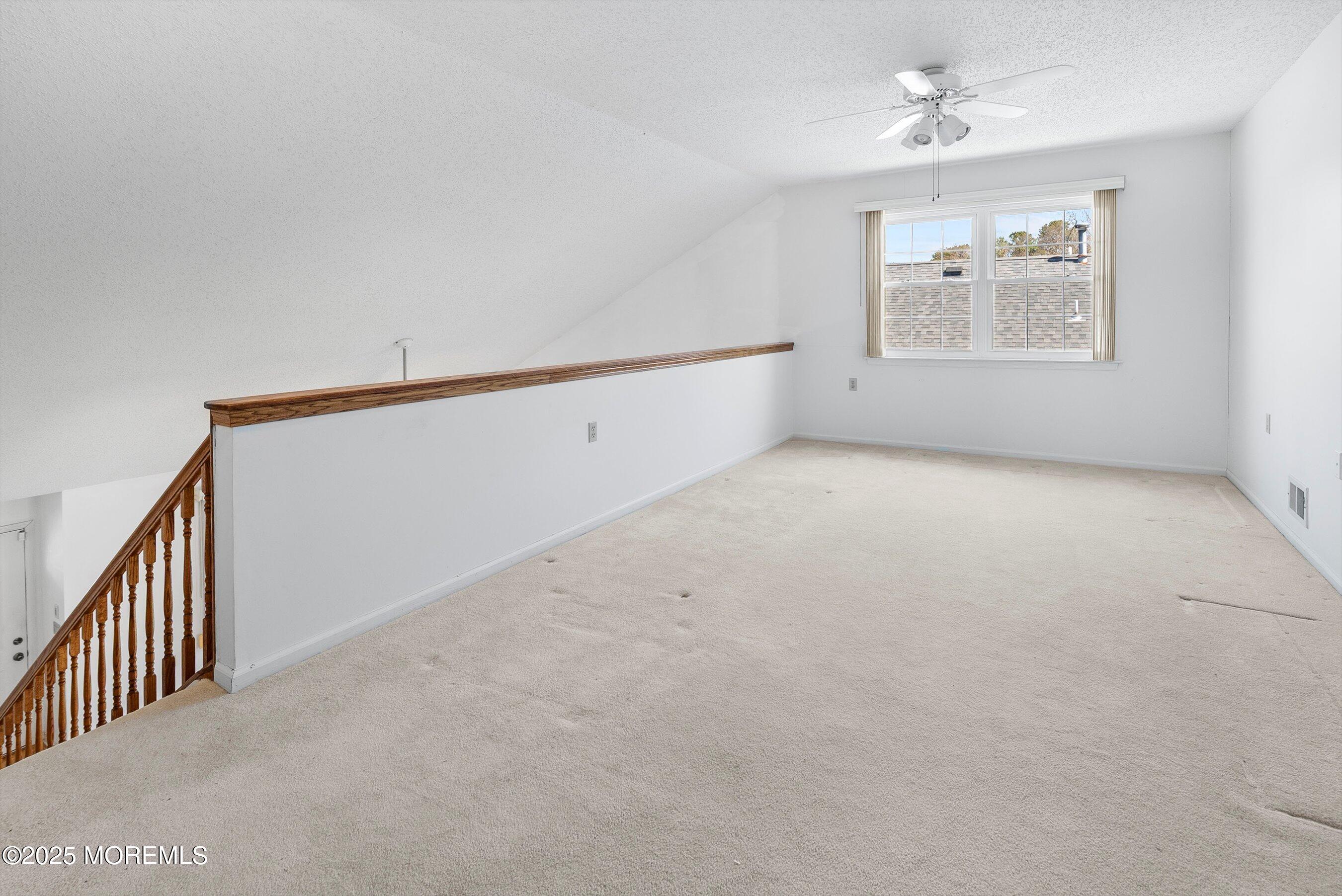 32 Pine Oak Boulevard Barnegat, NJ 08005 - Photo 27 of 40 an empty room with windows and ceiling fan