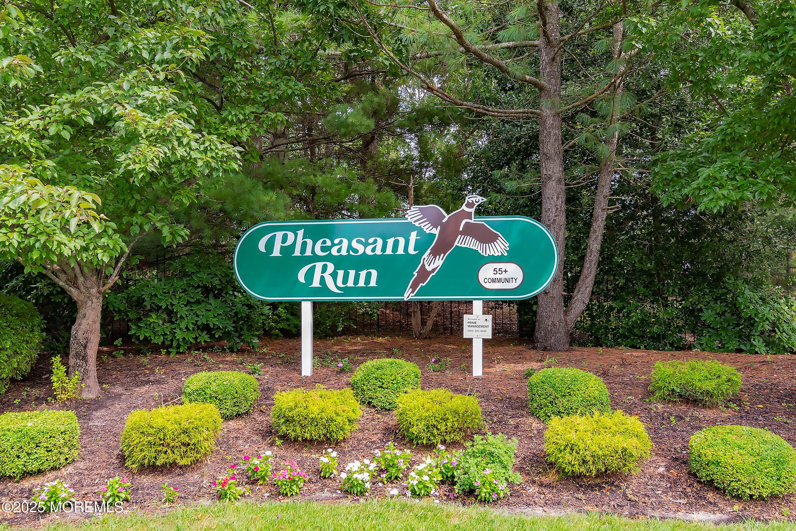 32 Pine Oak Boulevard Barnegat, NJ 08005 - Photo 35 of 40 a sign that is sitting in front of flowers