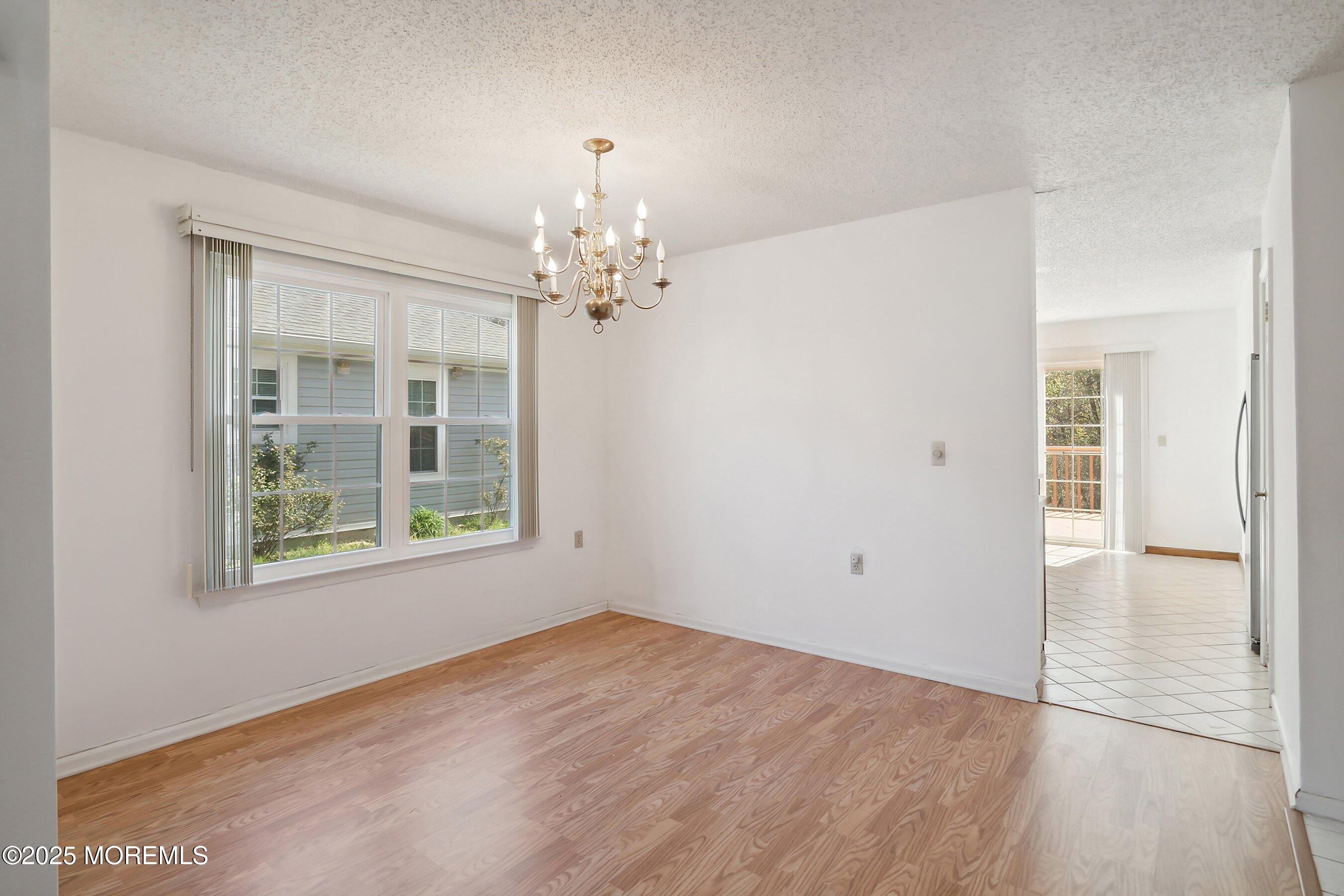 32 Pine Oak Boulevard Barnegat, NJ 08005 - Photo 5 of 40 wooden floor in an empty room with a window