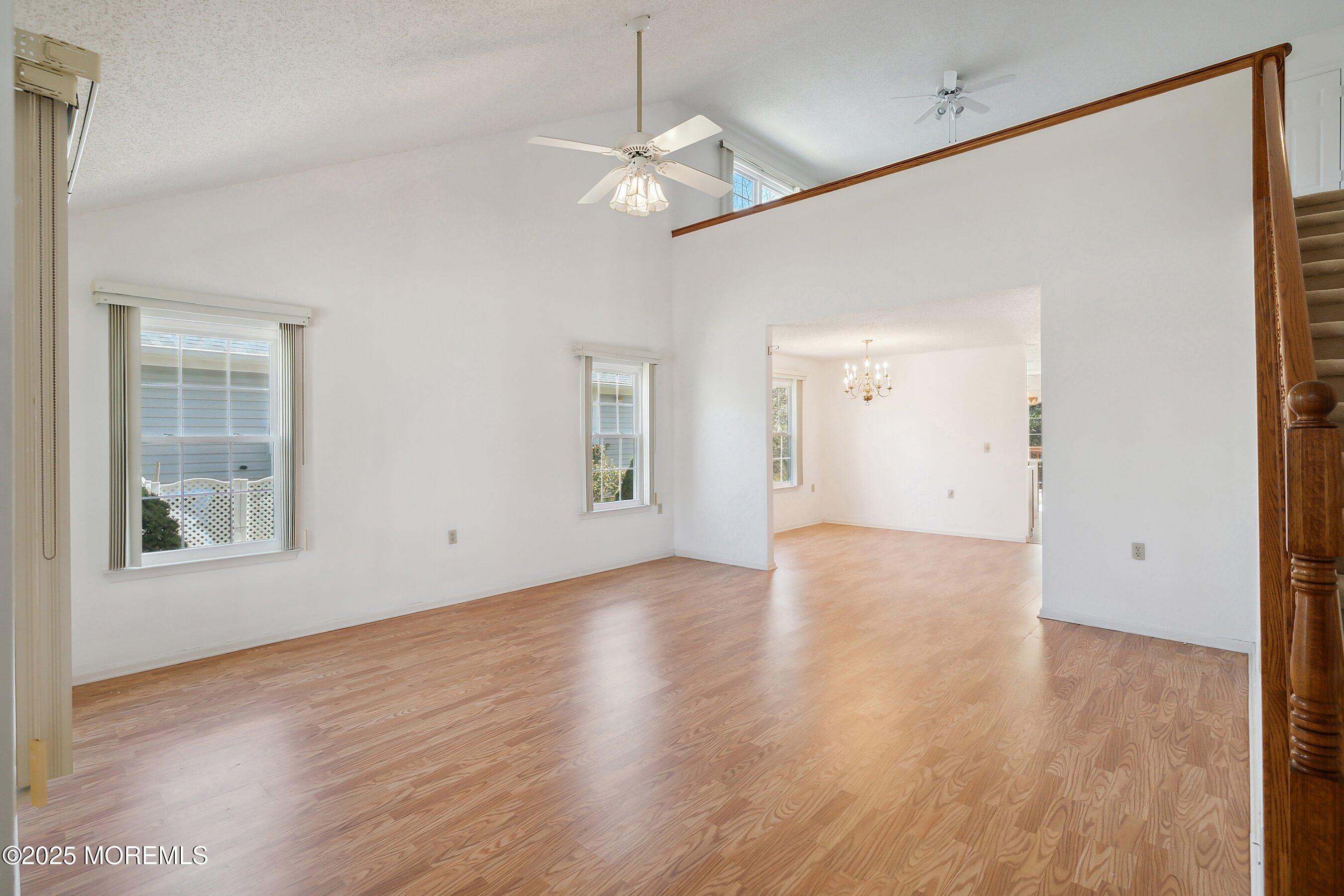 32 Pine Oak Boulevard Barnegat, NJ 08005 - Photo 8 of 40 a view of an empty room with wooden floor and a window