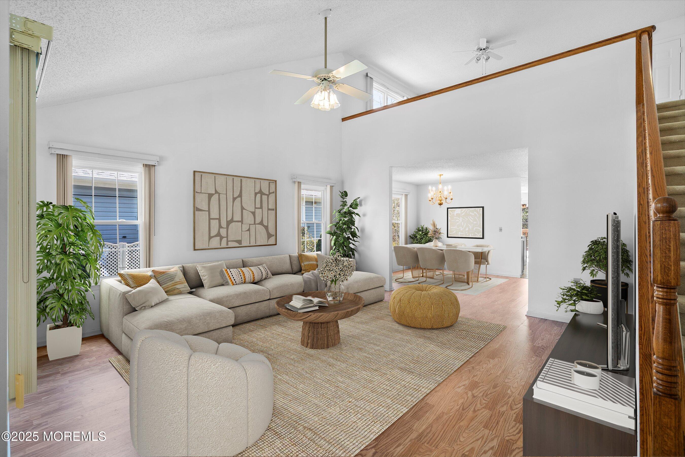32 Pine Oak Boulevard Barnegat, NJ 08005 - Photo 9 of 40 a living room with furniture and a chandelier